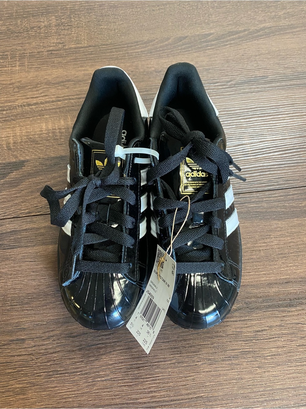 adidas Black & White Shell Toe Sneakers with Gold Logo